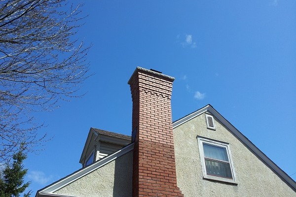 Brick chimney with stone cap