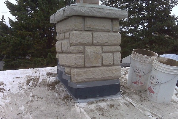 Stone chimney with stone cap